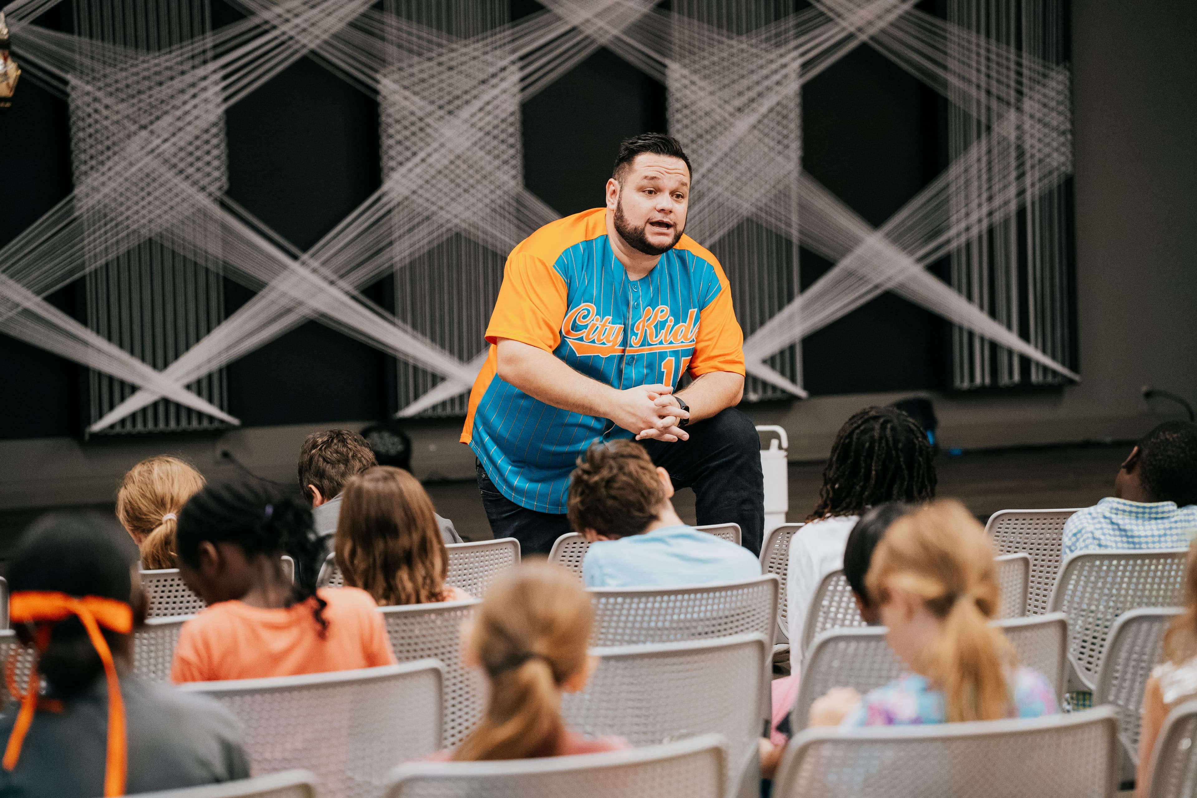 Pastor John speaking to city kids. 